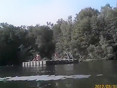 Naked pregnant redhead out on the lake