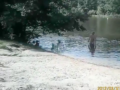 Naked pregnant redhead out on the lake