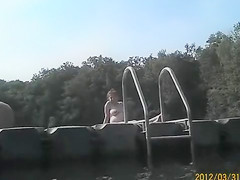 Naked pregnant redhead out on the lake