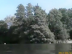 Naked pregnant redhead out on the lake