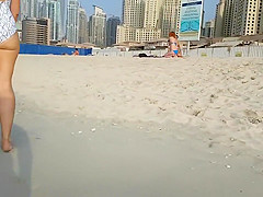 Tight swimsuit exposes the lusty curves of a delicious woman