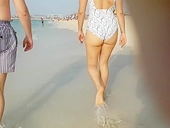 Tight swimsuit exposes the lusty curves of a delicious woman