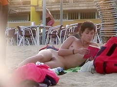 Attractive Italian woman sunbathes completely naked