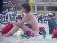Attractive Italian woman sunbathes completely naked