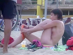 Attractive Italian woman sunbathes completely naked