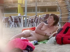 Attractive Italian woman sunbathes completely naked