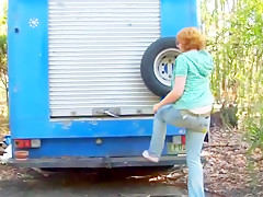 Trailer in the forest and redhead beauty