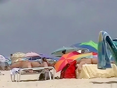 Gorgeous hottie rubs oil into huge tits