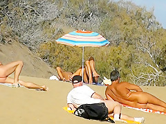 Public pussy fingering at the beach