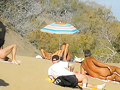 Public pussy fingering at the beach