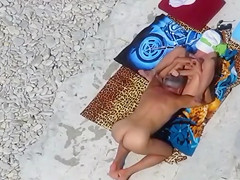 Middle aged couple has hardcore sex on the rocky beach