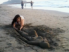 Sexy young brunette gets jizzed at the beach by stranger