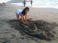 Sexy young brunette gets jizzed at the beach by stranger