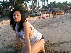 Sexy young brunette gets jizzed at the beach by stranger