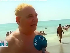 Mature Spanish nudists walk around the beach completely naked