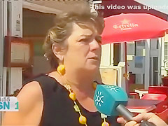 Mature Spanish nudists walk around the beach completely naked