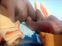 Hairy husband gets a handjob from his wife in public