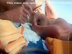 Hairy husband gets a handjob from his wife in public