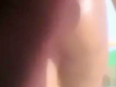 Black bubble butt in a skimpy bikini at the beach