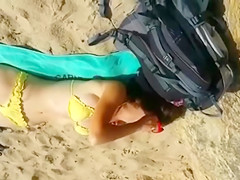 Cumming to a sleeping bikini girl on the beach