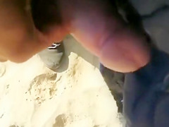 Cumming to a sleeping bikini girl on the beach