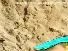 Cumming to a sleeping bikini girl on the beach