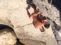 Filly's pussy gets penetrated on the rocky beach