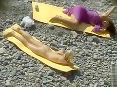 Two skinny young beauties tan nude