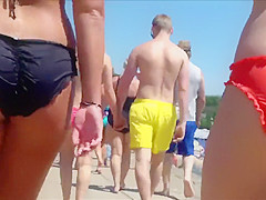 Big female booty in an orange bikini is breathtaking