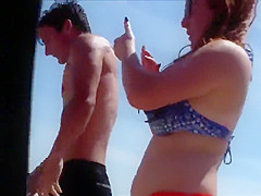 Big female booty in an orange bikini is breathtaking