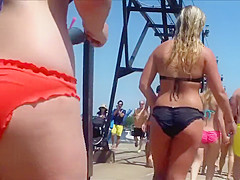 Big female booty in an orange bikini is breathtaking