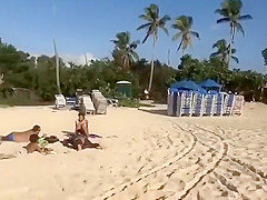 Topless girl on the beach has a nice booty