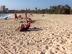 Topless girl on the beach has a nice booty