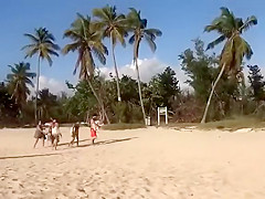 Topless girl on the beach has a nice booty