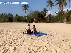 Topless girl on the beach has a nice booty