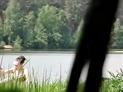 girl sunbathing on the pond