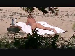 voyeur catches MILF on a beach