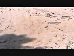 voyeur catches MILF on a beach