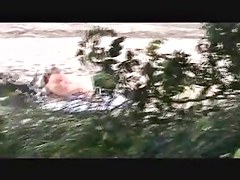 voyeur catches MILF on a beach
