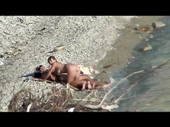 Couple fucking on a public beach, while walking past people