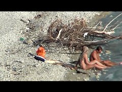 Couple fucking on a public beach, while walking past people