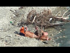 Couple fucking on a public beach, while walking past people