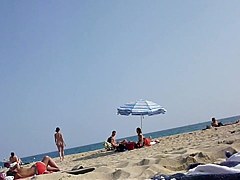 Walking naked on the beach