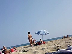 Walking naked on the beach