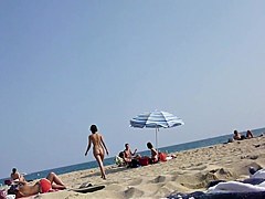 Walking naked on the beach