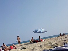 Walking naked on the beach