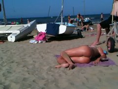 Flawless topless blond butt on the beach