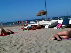 Flawless topless blond butt on the beach