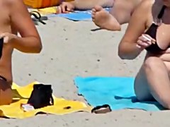 Beach voyeur 02 - A topless gril and her large boobs ally