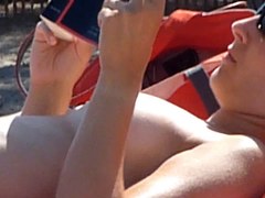 Beach voyeur 05 - Admirable topless cutie reads a book